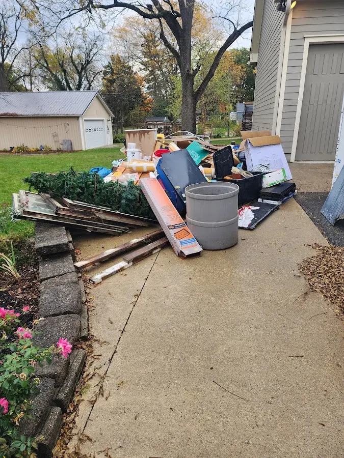 Dumpster being loaded with debris for 3 Yard Dumpster Rental in Northumberland